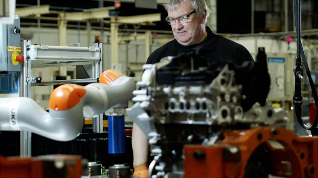 Robbie the robot aids employees with disabilities at the Ford factory